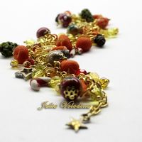 Браслет "Красно-желтый Мандариновый Новый год" в красно-желтой-золотой гамме с множеством мельчайших элементов.Елочные шары, шишки, мандарины елочки, леденцы, звездочки! 1350 руб